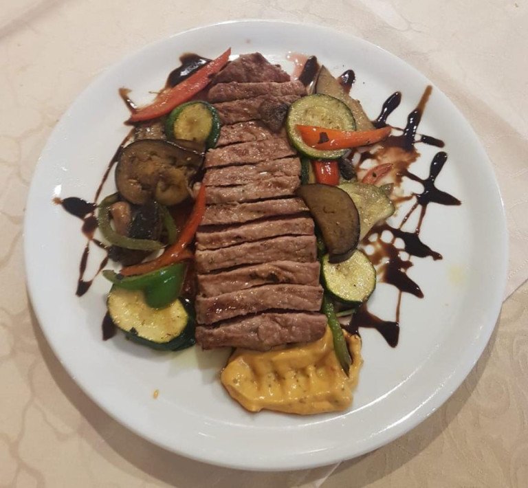 Beef steak with side dishes at Restaurant Babilon in Split