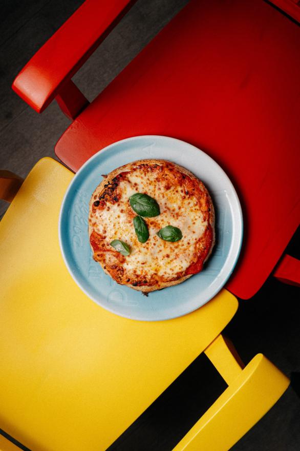 Authentic Margherita pizza with fresh basil on a colorful backdrop, Salsa restaurant Split