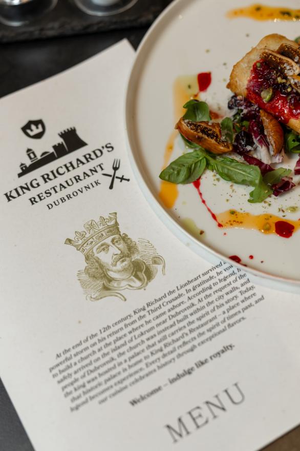 The menu of King Richard's Restaurant with an illustration of King Richard the Lionheart next to an elegantly decorated plate with fresh figs and sauce