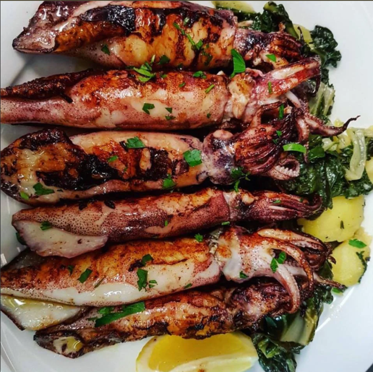Freshly grilled Adriatic squid served with traditional Swiss chard, potatoes, and lemon at Restoran Nautica in Split